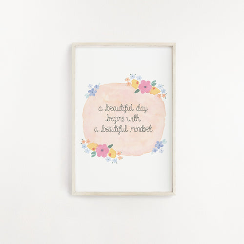 A pretty print with the inspiring quote, 'a beautiful day begins with a beautiful mindset' lettered onto a peachy background and surrounded by pretty florals. A lovely print to add to your home or gift a loved one.
