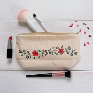 A canvas zip pouch with a pretty floral design painted in the centre with a bible verse on the other side, the perfect gift for christians
