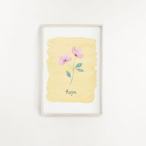 A lovely wall print with a watercolour yellow background with the word hope lettered beneath a pink flower. A dainty and elegant print to add to your home.