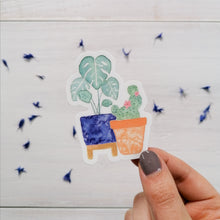 Load image into Gallery viewer, A house plant illustration sticker with a fun little monstera plant and cactus hand painted design. 