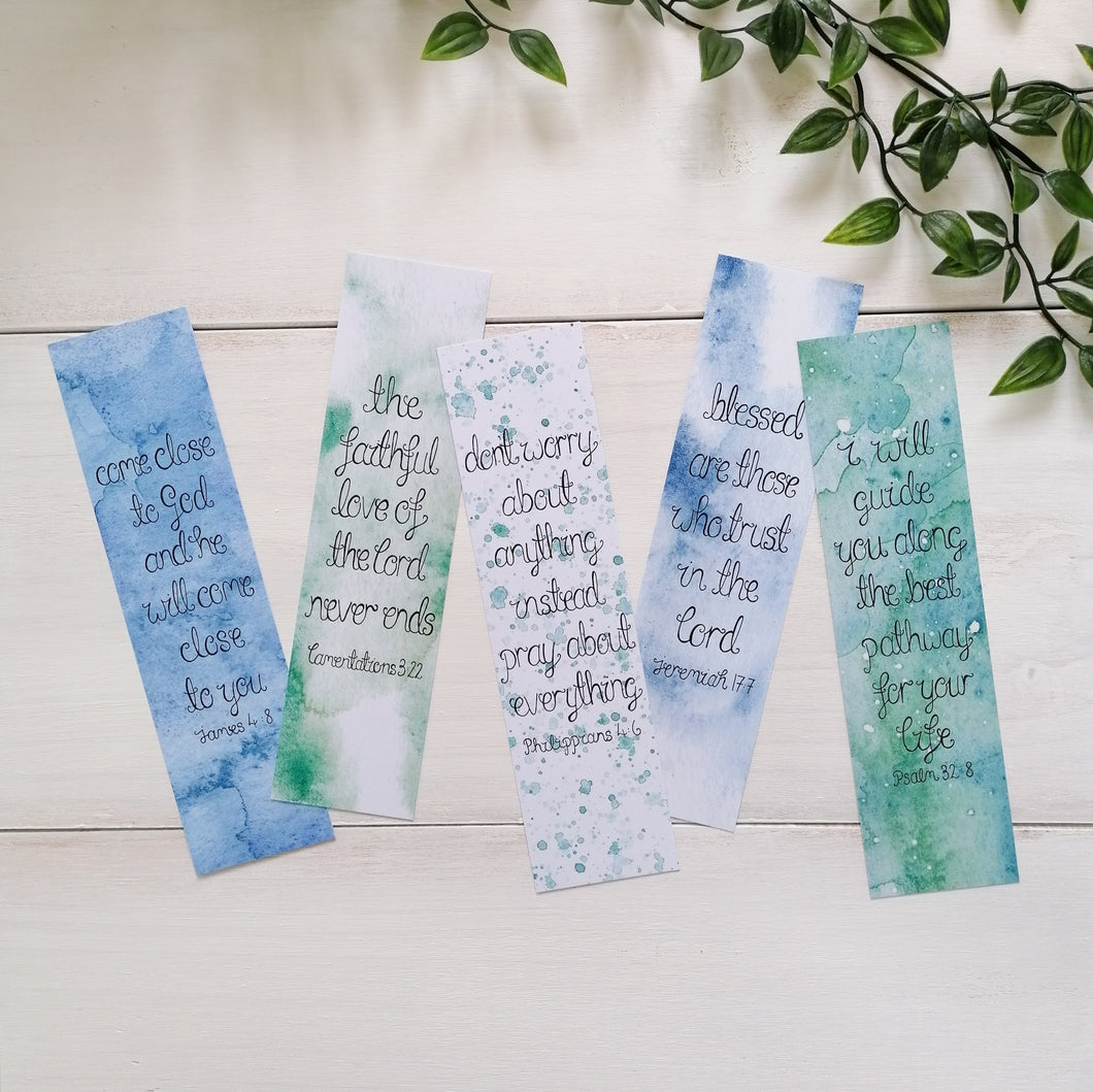 set of 5 christian scripture bookmarks with a blue and green backgrounds and uplifting bible verses hand lettered on the front