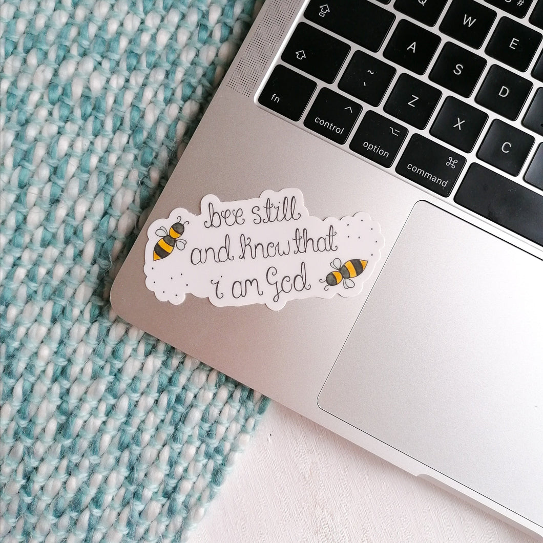 bumble bee christian sticker with the words be still and know that I am god with bees flying around the bible verse