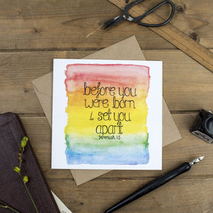 An encouraging new baby card with the words, 'before you were born I set you apart - Jeremiah 1:5' lettered onto a watercolour rainbow background. A lovely card to fill with encouraging and loving words.
