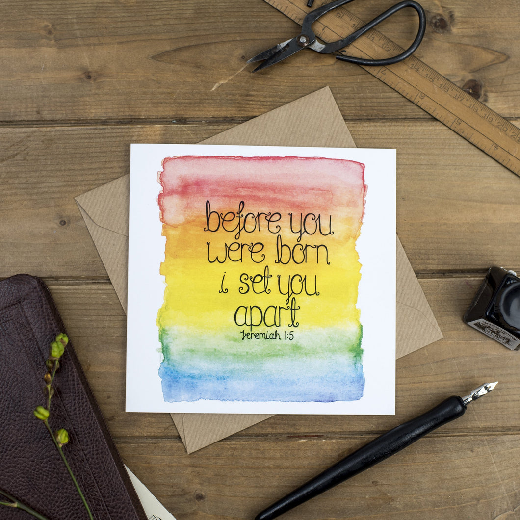 An encouraging new baby card with the words, 'before you were born I set you apart - Jeremiah 1:5' lettered onto a watercolour rainbow background. A lovely card to fill with encouraging and loving words.