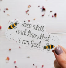 Load image into Gallery viewer, christian sticker with the words bee still and know with a bee design,