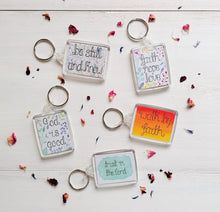 Load image into Gallery viewer, Treasured Creativity&#39;s collection of Christian keychains and bible verse keyrings, all with uplifting verses and watercolour designs.