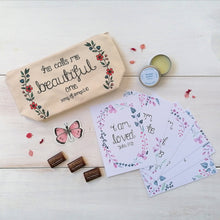 Load image into Gallery viewer, pretty christian gift box for women, including a christian makeup bag, mini bible verse print set, organic lip balm, vinyl sticker and fair trade chocolates