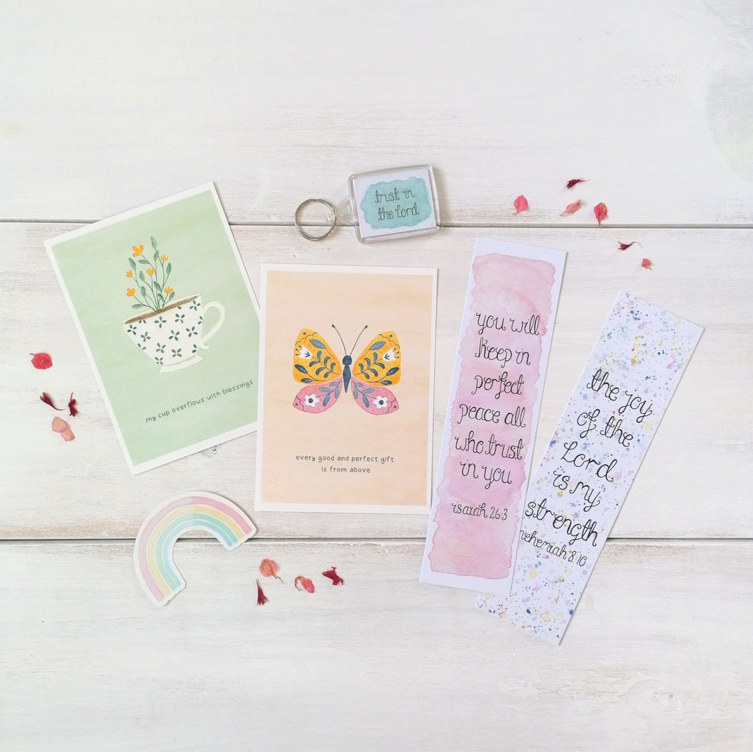 christian gift box including christian postcards, bible verse bookmarks, scripture keychain and vinyl sticker