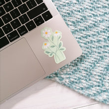 Load image into Gallery viewer, daisy sticker for your laptop, three daisies intertwined on a pale green background