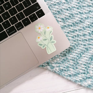 daisy sticker for your laptop, three daisies intertwined on a pale green background