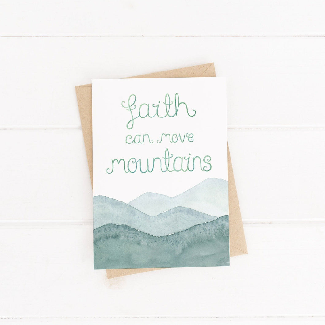 An abstract hand painted watercolour mountain landscape greeting card with the words, 'faith can move mountains.' An uplifting Christian quote card to fill with encouraging words.
