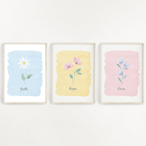pretty wall print set of 3 designs with the words faith hope love written on each print with a dainty flower painted above the words with a pastel background colour. A stunning set of prints to have in the home.
