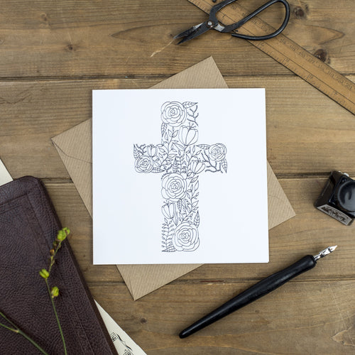 A pretty hand illustrated black and white greeting card of a cross shaped from flowers and leaves, a lovely greeting card to fill with encouraging words.