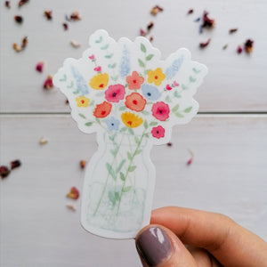 hand illustrated flower bouquet sticker with vibrant pinks, blues and yellows found in the design