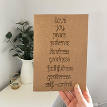 Load image into Gallery viewer, A Bible verse journal with the words from Galatians 5:22, &#39;love, joy, peace, patience, kindness, goodness, faithfulness, gentleness &amp; self control&#39; lettered on the notebook.