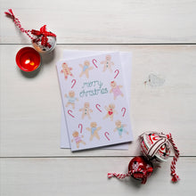 Load image into Gallery viewer, A cute gingerbread man patterned Christmas card to spread joy and festive cheer, with the words merry christmas lettered in green watercolour