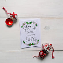 Load image into Gallery viewer, A watercolour holly and mistletoe wreath design with the words, glory to the newborn king lettered at the centre.