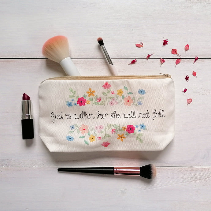 A beautiful Christian makeup bag with the words, 'God is within her she will not fall' inspired by Psalm 46:5 surrounded by a stunning watercolour floral design.