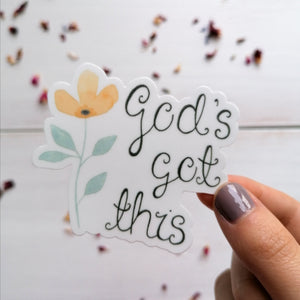 christian vinyl sticker with uplifting quote saying, god's got this, and pretty peach flower