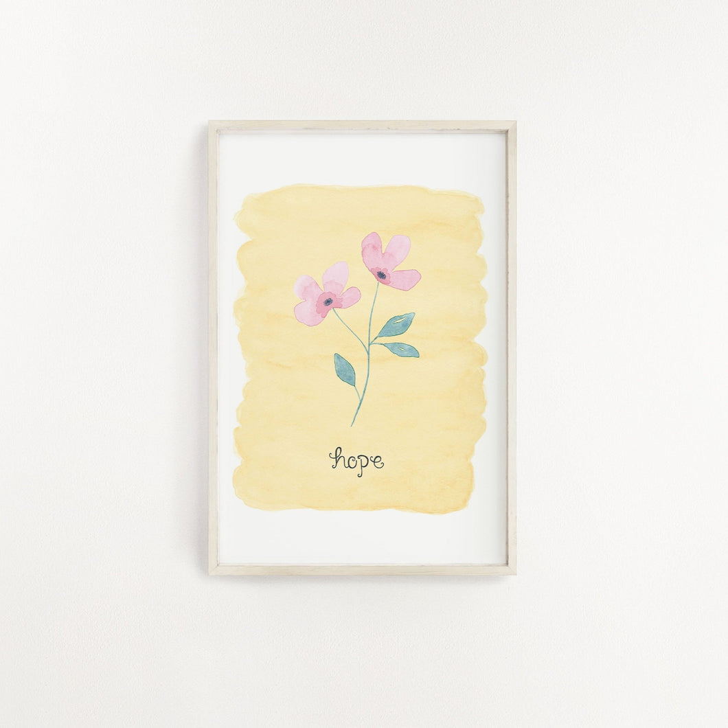 A lovely wall print with a watercolour yellow background with the word hope lettered beneath a pink flower. A dainty and elegant print to add to your home.