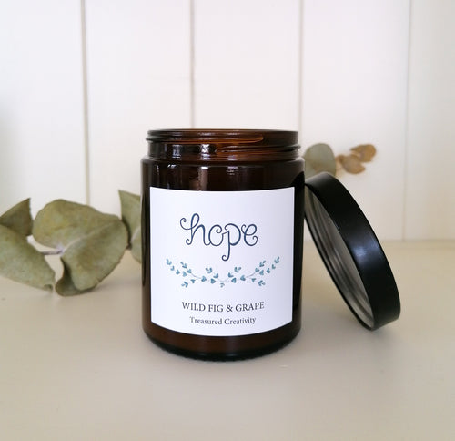 wild fig and grape soy candle in recycled amber glass jar