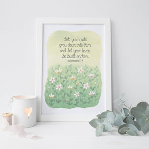 A stunning art print with the words from Colossians 2:7, 'let your roots grow down into him and let your lives be built on Him' with a stunning design beneath the Bible verse of a meadow of wild daisies.