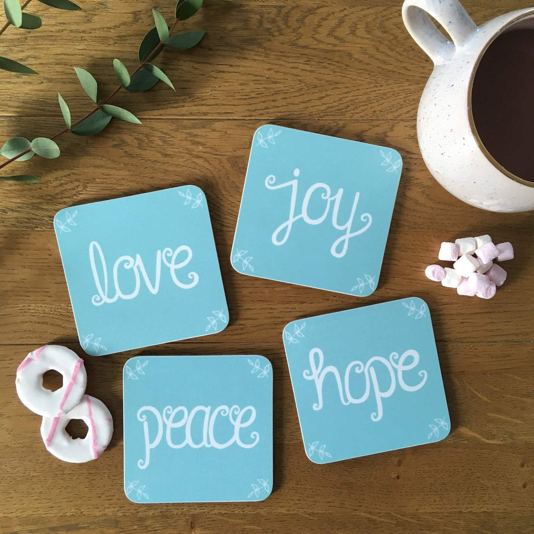 Lovely blue coaster set with the words, 'love, joy, peace & hope' lettered on each coaster. Sweet uplifting coasters to add the finishing touch to your home.