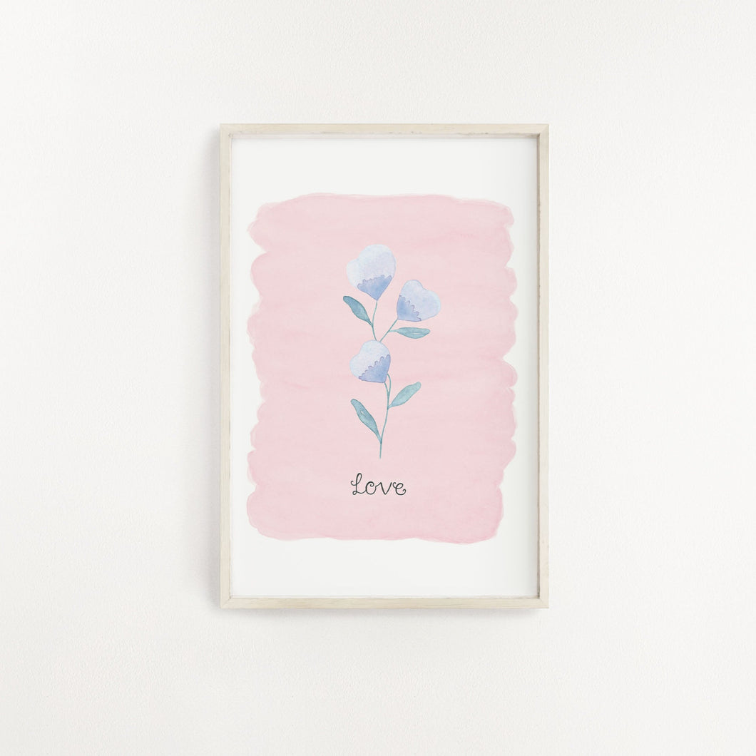 A striking wall print of a purple flower with the word Love lettered beneath and a complimentary pale pink background. A sweet addition to add to your home.