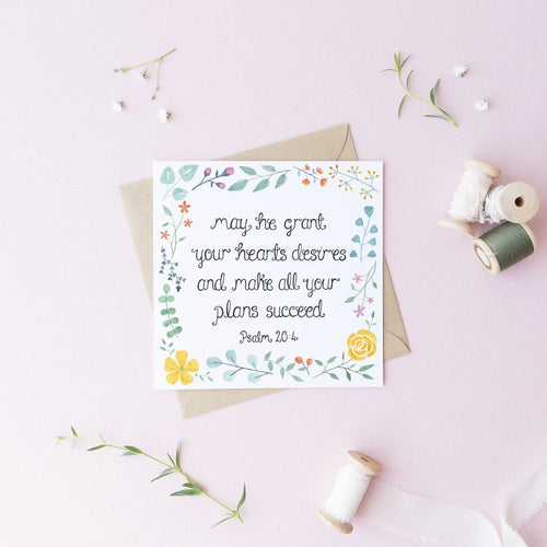 A pretty Christian encouragement card with the words, 'may he grant your hearts desires and make all your plans succeed - Psalm 20:4' lettered at the centre of the design with a multicoloured leaf and flower pattern surrounding the verse. A lovely card to use on a baptism, birthday, or as an encouragement.