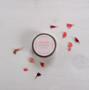 peaches and cream lip balm with the words you are loved on the design