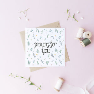 A hand illustrated leaf pattern greeting card with the words, praying for you lettered at the centre. A stunning greeting card to be used for many occasions, whether for encouragement, sympathy, or as a just because