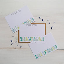Load image into Gallery viewer, set of 10 note cards with the words praying for you written at the top with a leafy pattern at the bottom. A notecard set to write prayers for friends and fill with words of encouragement. Set of 10 notecards with envelopes