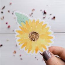 Load image into Gallery viewer, hand illustrated vinyl sticker of a sunflower with a leaf
