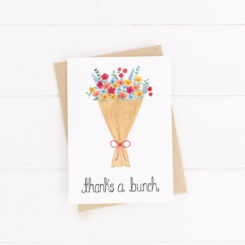 A vibrant floral bouquet card with the words thanks a bunch hand written on the design. A lovely way to send words of thanks and appreciation to a loved one.