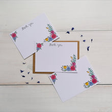 Load image into Gallery viewer, set of floral thank you notecards, with the words thank you lettered across the top of the notecard and a vibrant floral design in the corners, leaving space in the middle for your own message of thanks to a friend