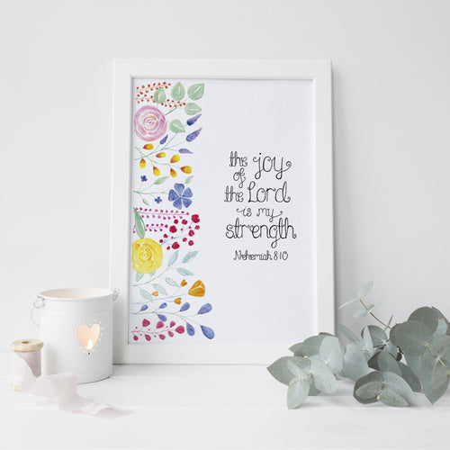 A vibrant piece of art with the words from Nehemiah 8:10, 'the joy of the Lord is my strength' lettered with colourful floral watercolour design beside the words. A stunning piece to add some colour to your walls or gift a friend on a special occasion such as a birthday or baptism.