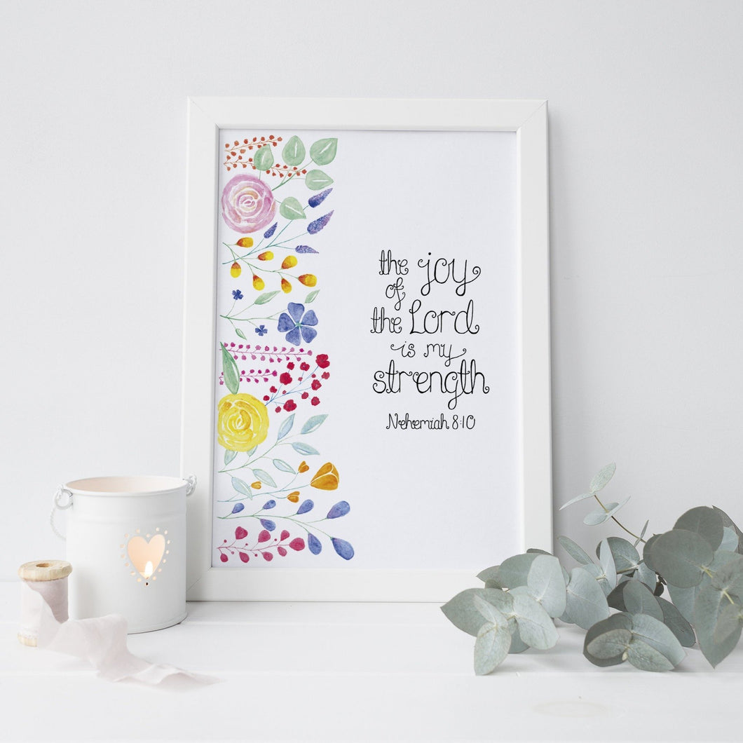 A vibrant piece of art with the words from Nehemiah 8:10, 'the joy of the Lord is my strength' lettered with colourful floral watercolour design beside the words. A stunning piece to add some colour to your walls or gift a friend on a special occasion such as a birthday or baptism.