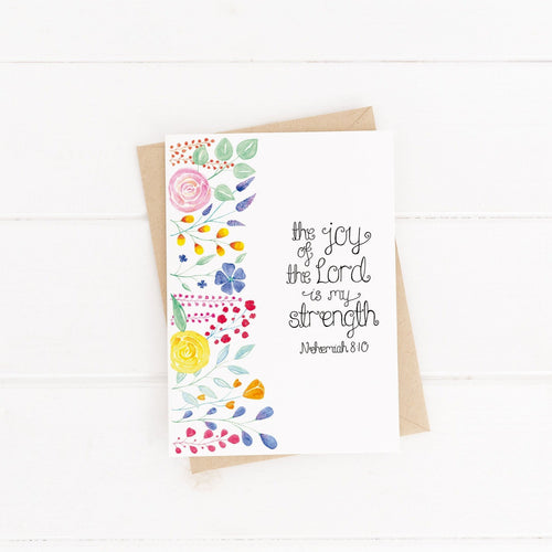 A pretty Bible verse card with the words, 'the joy of the Lord is my strength - nehemiah 8:10' lettered with a vibrant and multicoloured floral design. A lovely card to use for any occasion.