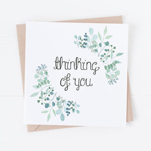 A hand illustrated greeting card with the words 'thinking of you' lettered at the centre of a stunning watercolour leaf design. A thoughtful card to send to a loved one when they are experiencing a difficult season or as an encouragement.