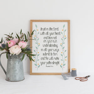 An uplifting Scripture art piece with the words from Proverbs 3:5, 'Trust in the Lord with all your heart and lean not on your own understanding, in all your ways submit to Him and He will make your paths straight.' Surrounding the words are dainty watercolour vines and flowers, a pretty piece to add some decoration to your home.