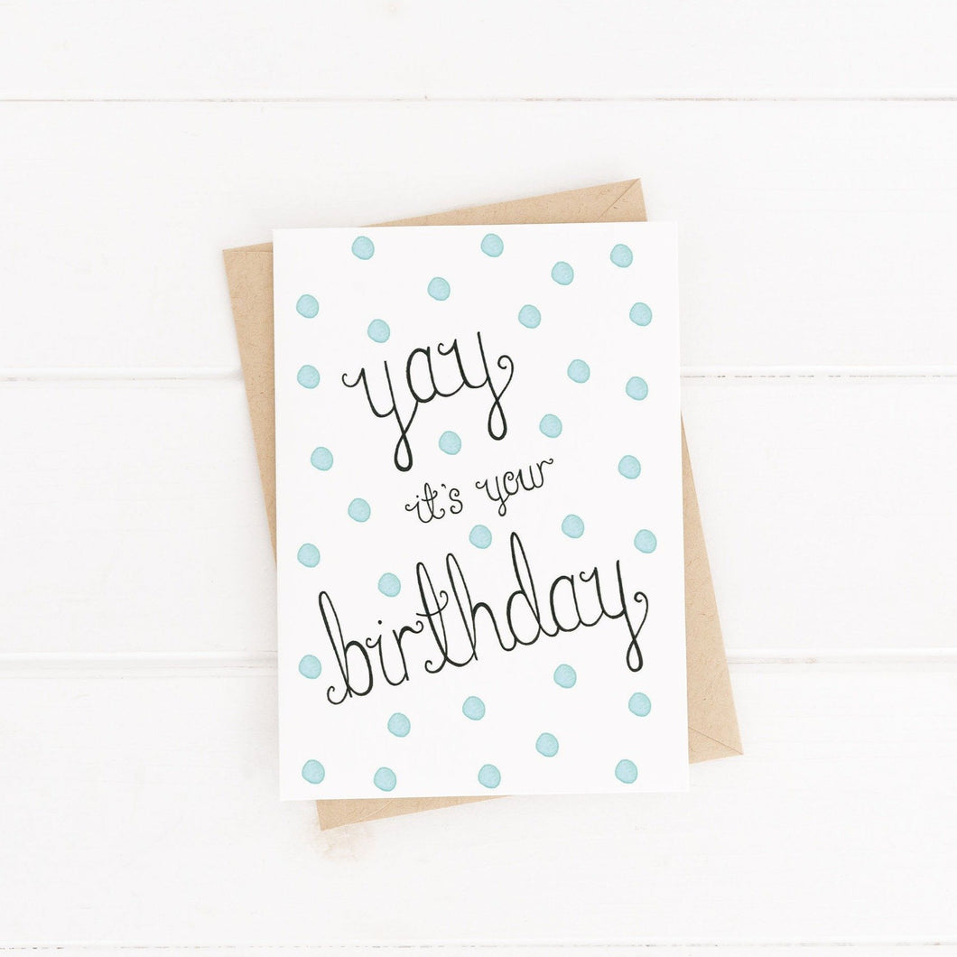 A baby blue spotted birthday cards with the words, 'yay it's your birthday' lettered at the centre, a fun birthday card to celebrate a loved ones special day.