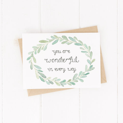 A beautifully illustrated greeting card of a hand painted leaf wreath with the words, you are wonderful in every way at the centre. A sweet card to fill with encouragement and loving words.